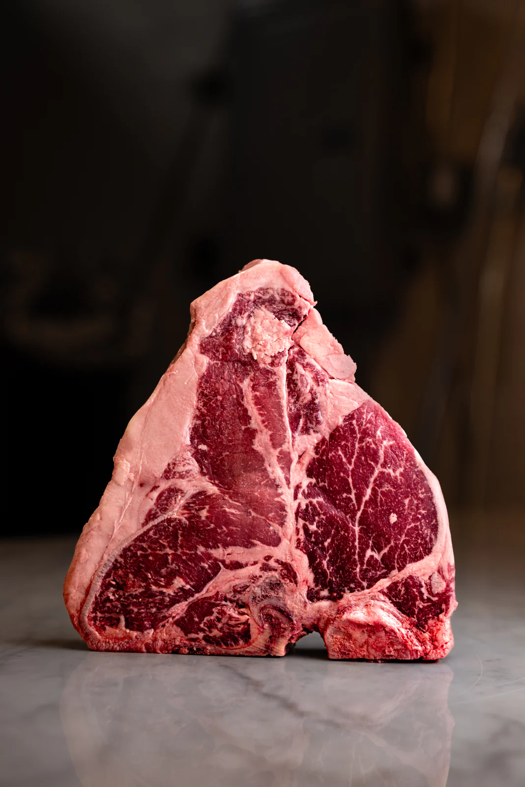 Dry-aged ribeye standing on marble