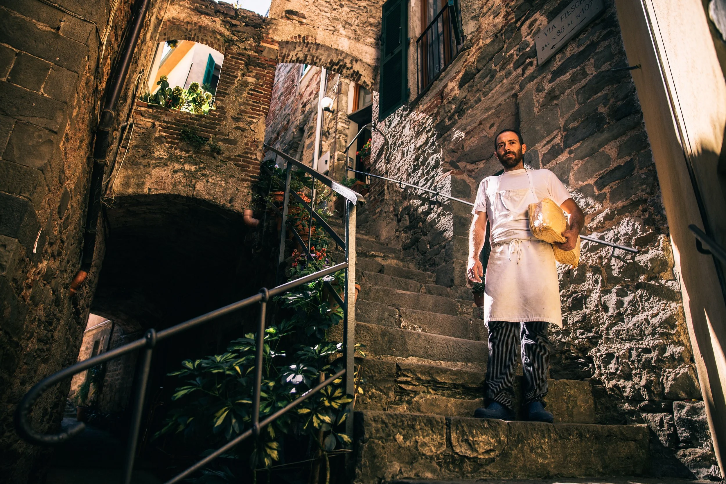 Chef in the alley behind the restaurant at night